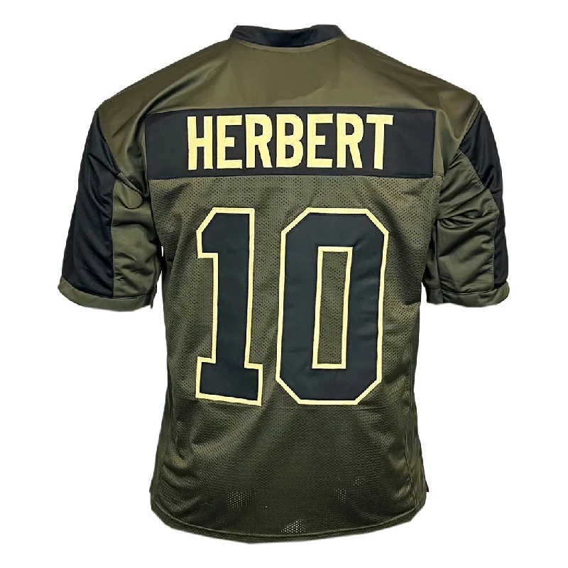 Custom soccer jerseys with team logos-Justin Herbert Unsigned Salute to Service Football Jersey